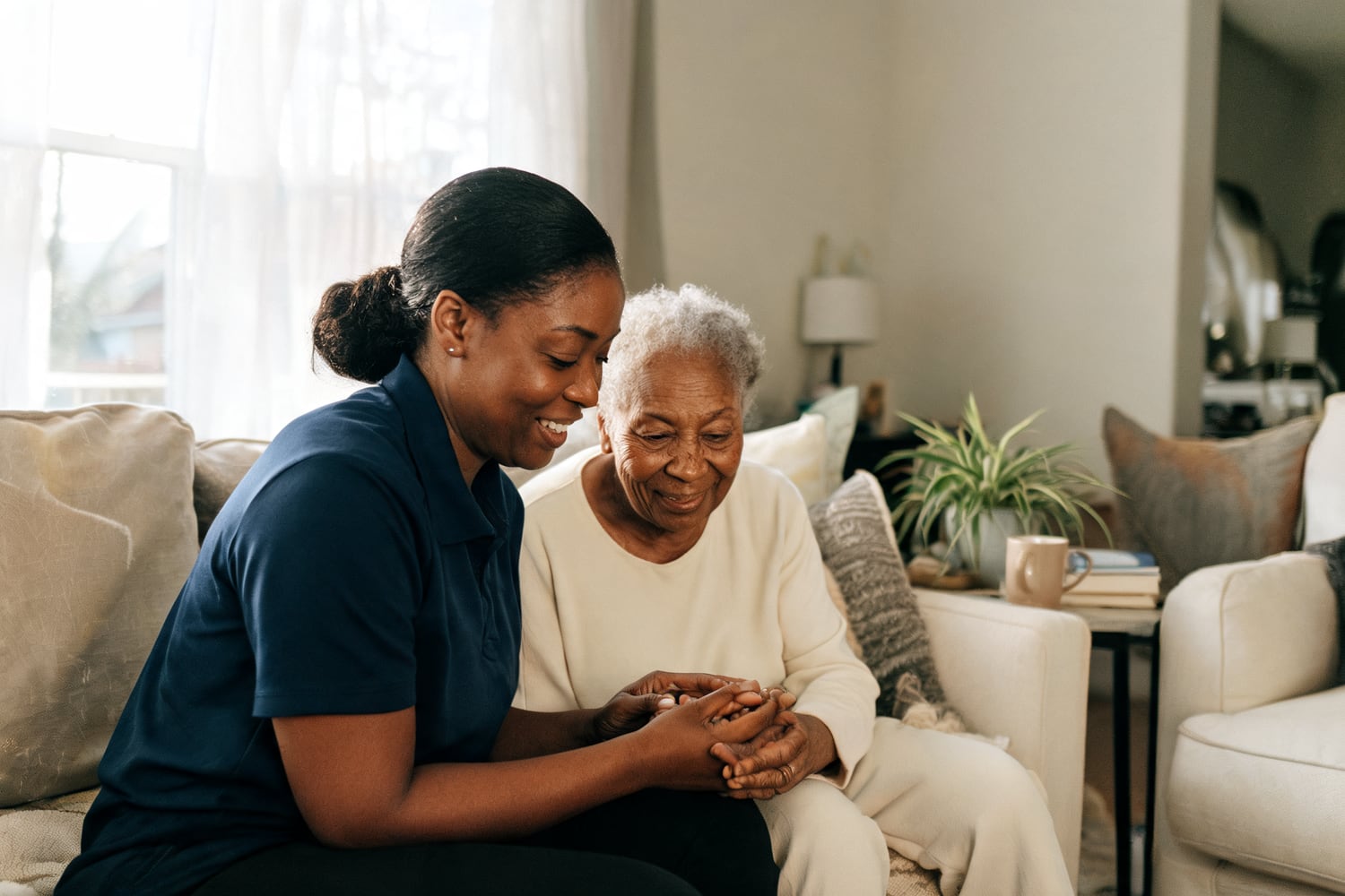Caregiver and older adult spending time together at home